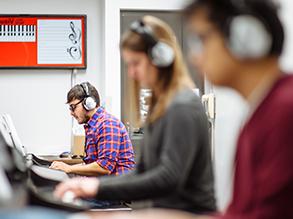 Students in a keyboard lab with headphones